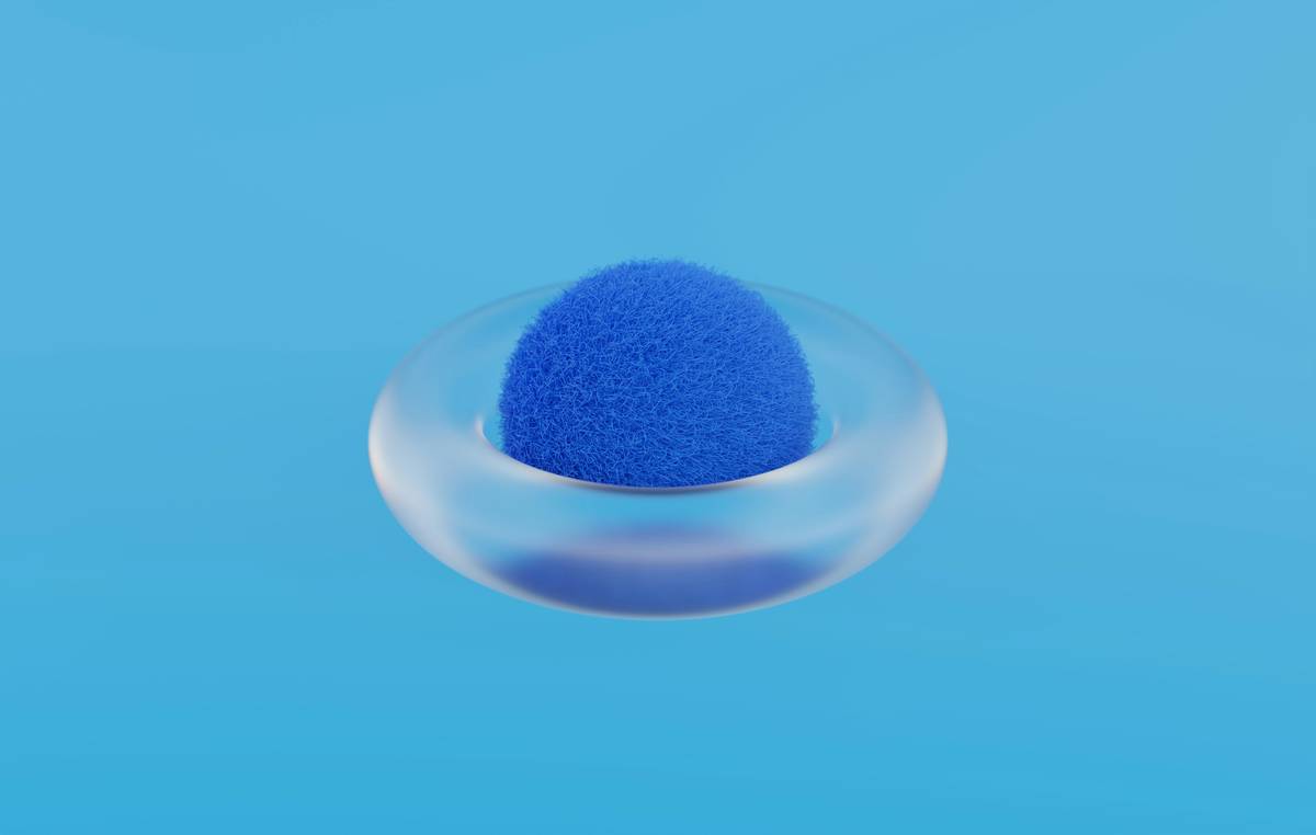 makeup blending tool kit showing three distinct tools: tear-drop sponge, tapered buffer brush, and micro-fiber blending pad arranged on clean marble surface